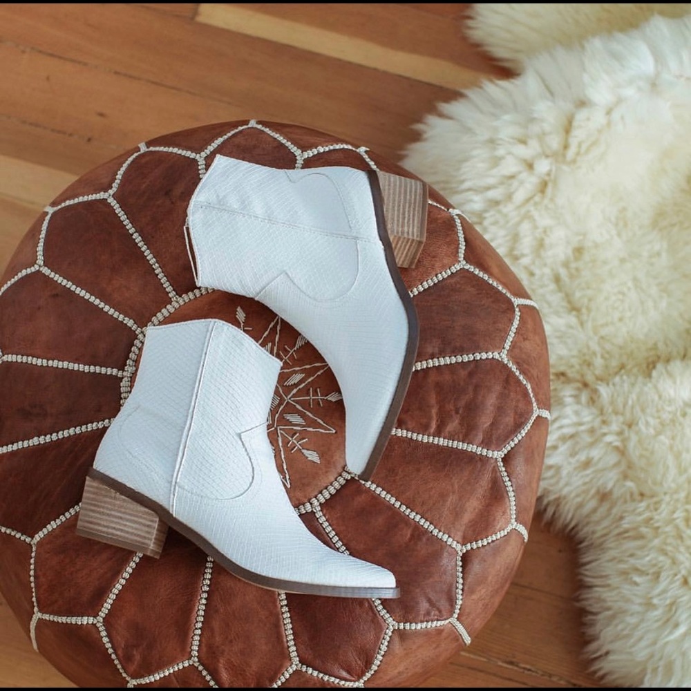 Report white snakeskin booties